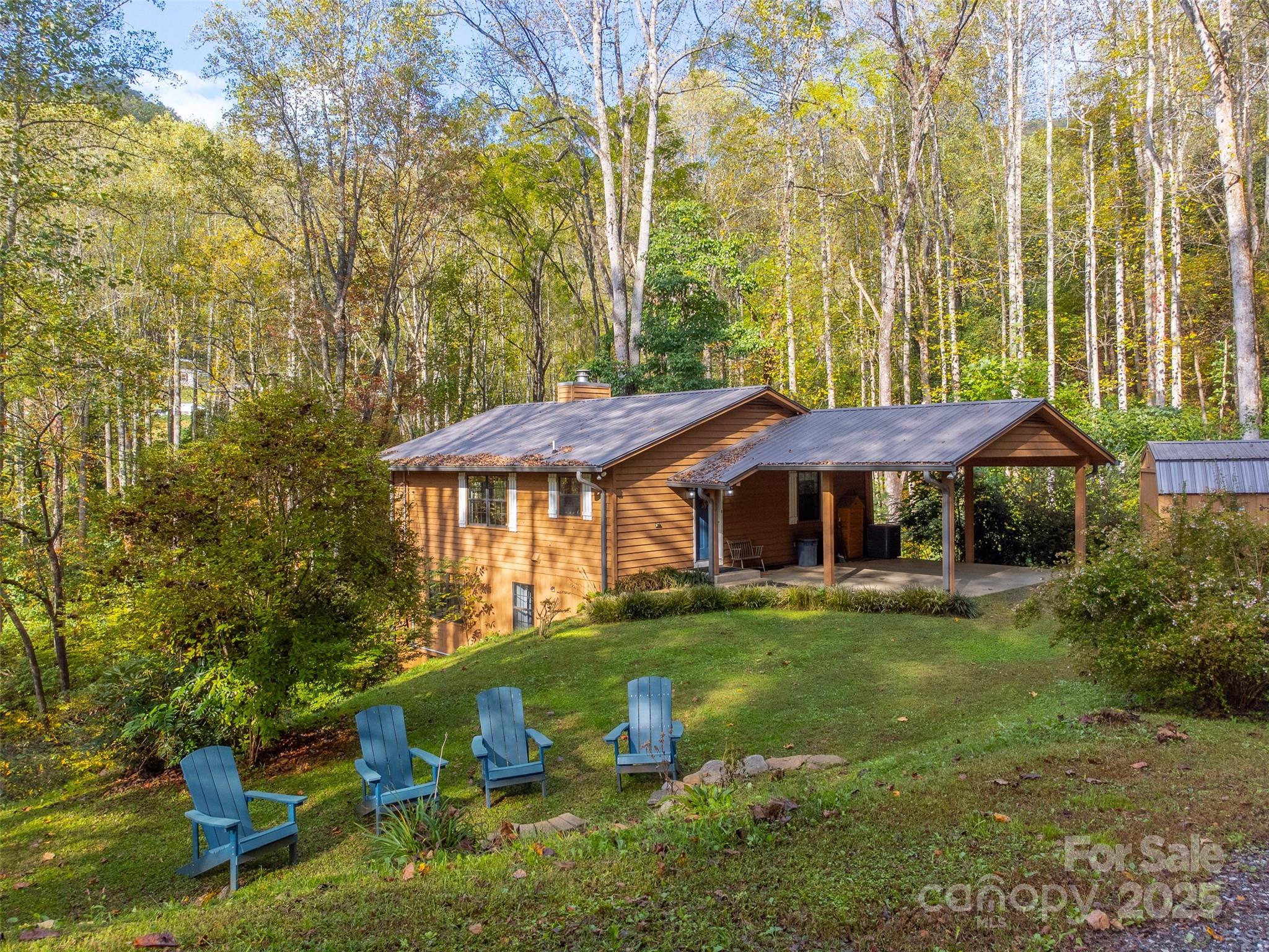 125 Nugget Lane Sylva, NC 28779 - Photo 3 of 30 a view of a house with backyard and sitting area