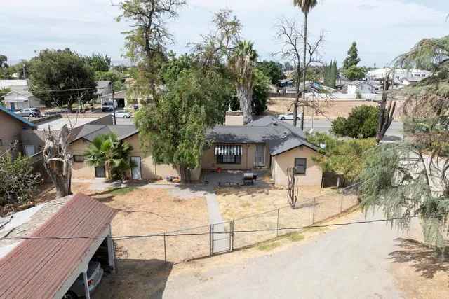 a view of a car parked in front of a house