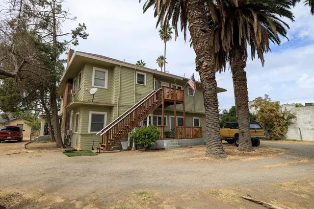 a street view with tall buildings and a street