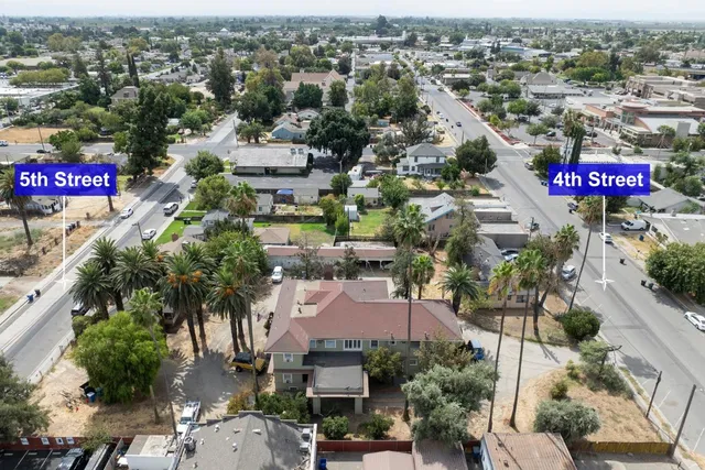 an aerial view of residential houses with outdoor space