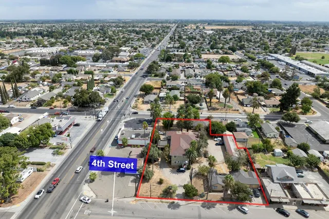 an aerial view of residential houses with outdoor space