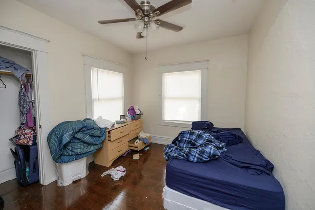 a bathroom with a sink a toilet and shower curtain