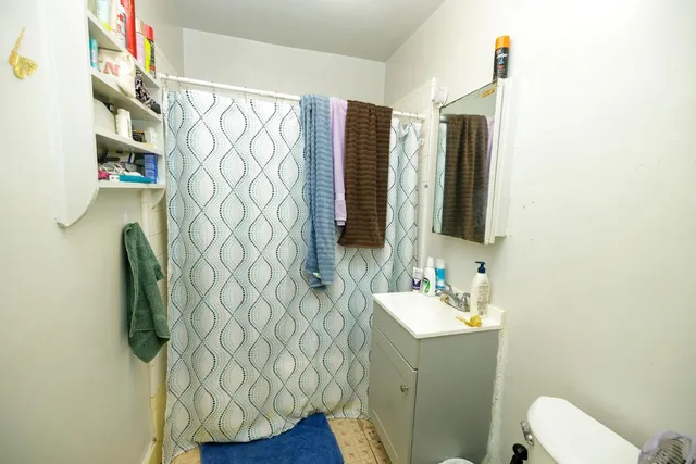 a view of a car parked in front of a house