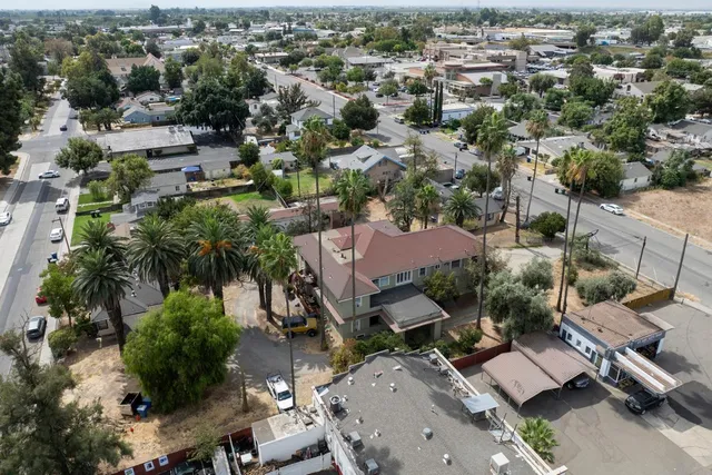 an aerial view of residential houses with outdoor space