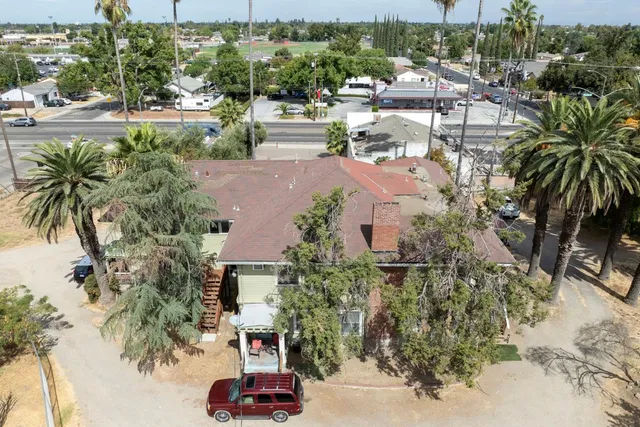 an aerial view of multiple houses with yard