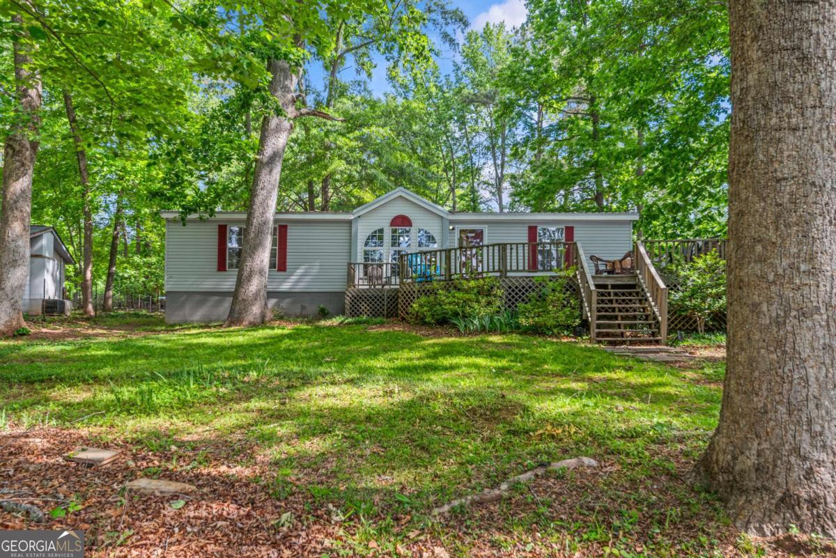 194 Phillips Road Eatonton, GA 31024 - Photo 45 of 57 a front view of a house with a yard