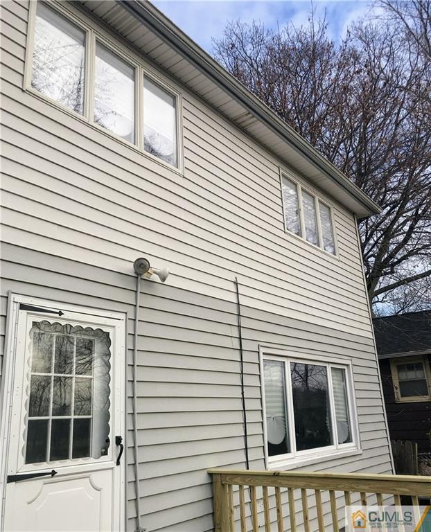 473 Harding Road Old Bridge, NJ 08879 - Photo 3 of 24 a view of a house with a window and brick wall
