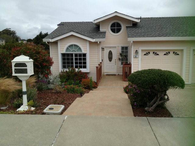 61 Ralston Ranch Road Belmont, CA 94002 - Photo 2 of 13 a front view of a house with garden