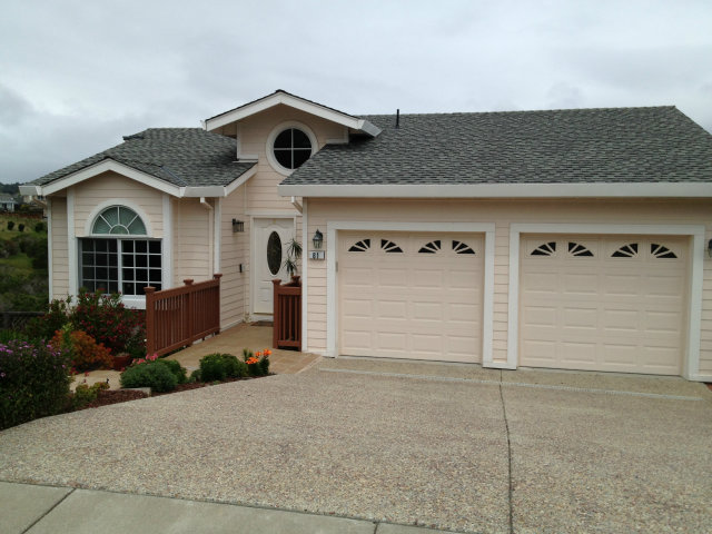 61 Ralston Ranch Road Belmont, CA 94002 - Photo 3 of 13 a front view of a house with a yard and garage
