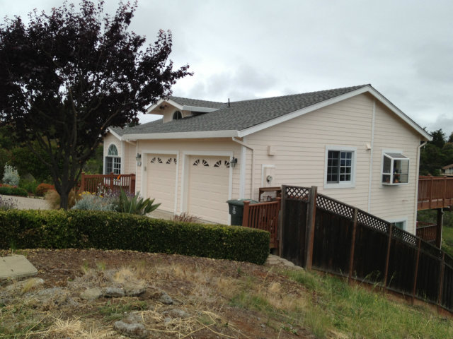 61 Ralston Ranch Road Belmont, CA 94002 - Photo 4 of 13 a front view of house with yard and trees around