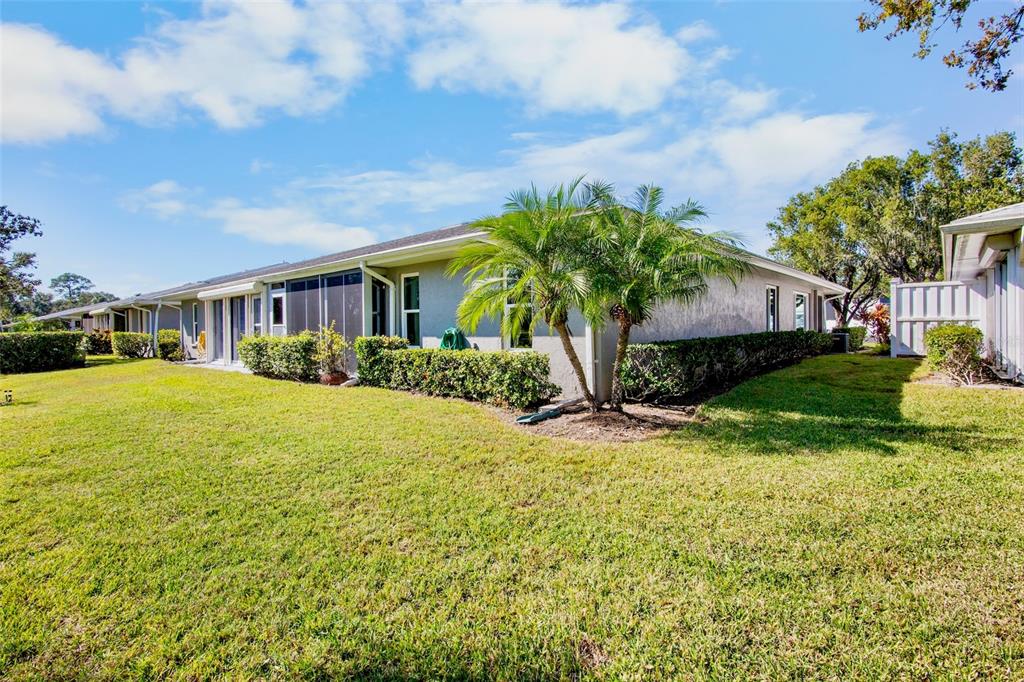 3905 Center Gate Circle, Unit 3 Sarasota, FL 34233 - Photo 18 of 20 a view of a house with a yard
