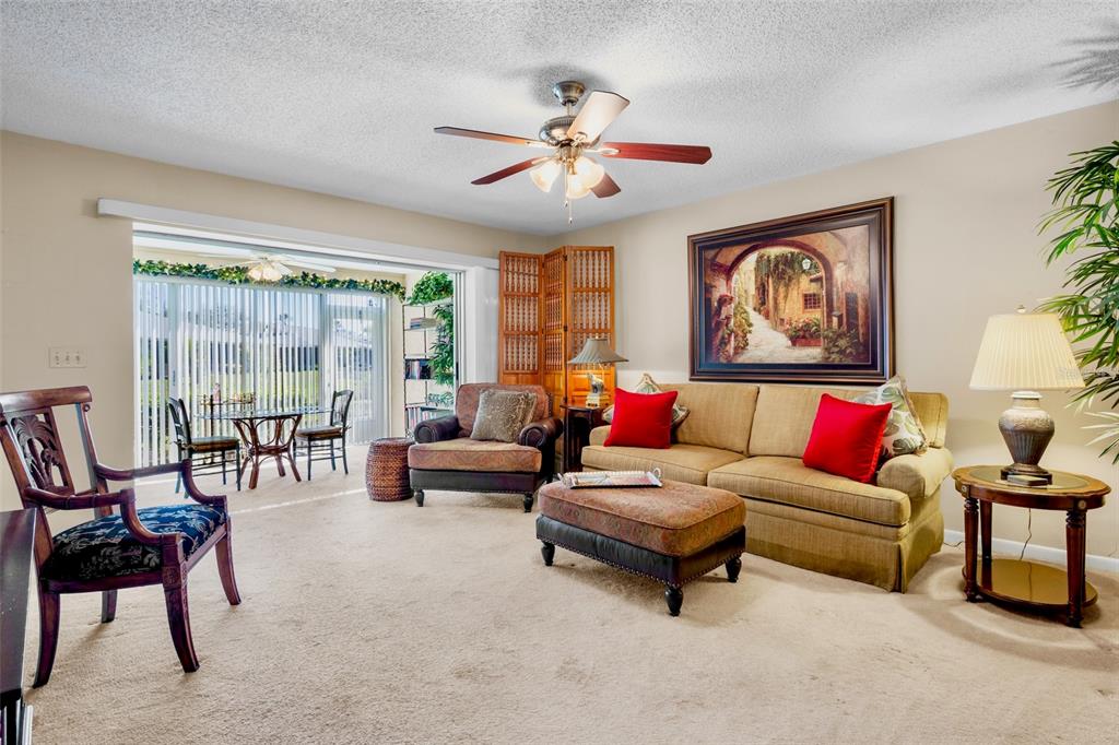 3905 Center Gate Circle, Unit 3 Sarasota, FL 34233 - Photo 10 of 20 a living room with furniture and a large window