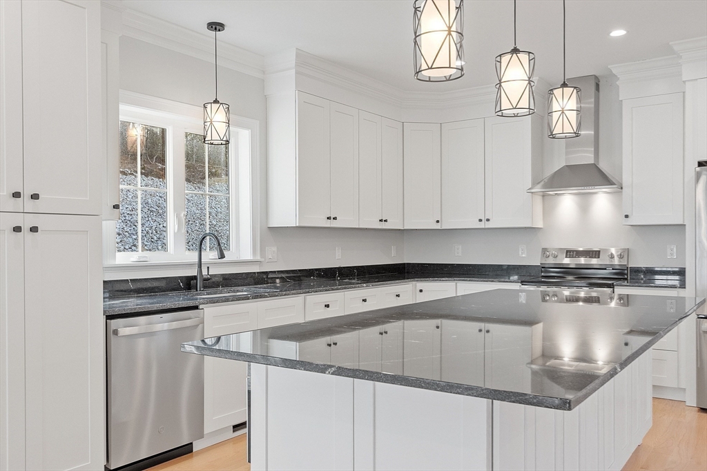 171 Upper Gore Road Webster, MA 01570 - Photo 14 of 42 a kitchen with granite countertop a sink a stove and cabinets