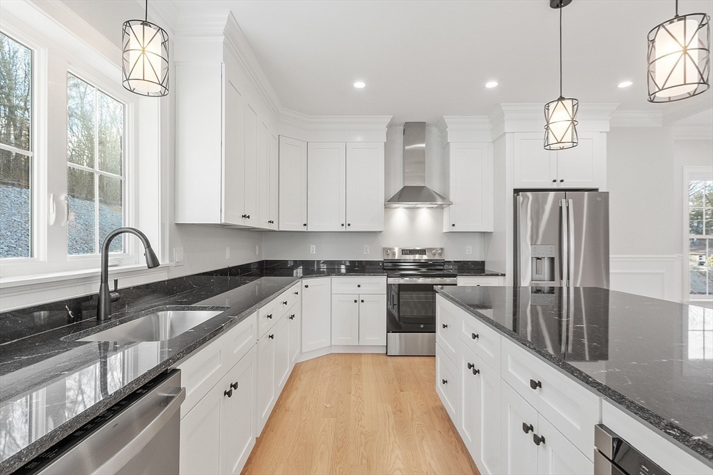171 Upper Gore Road Webster, MA 01570 - Photo 15 of 42 a large kitchen with stainless steel appliances granite countertop a sink a stove and a refrigerator
