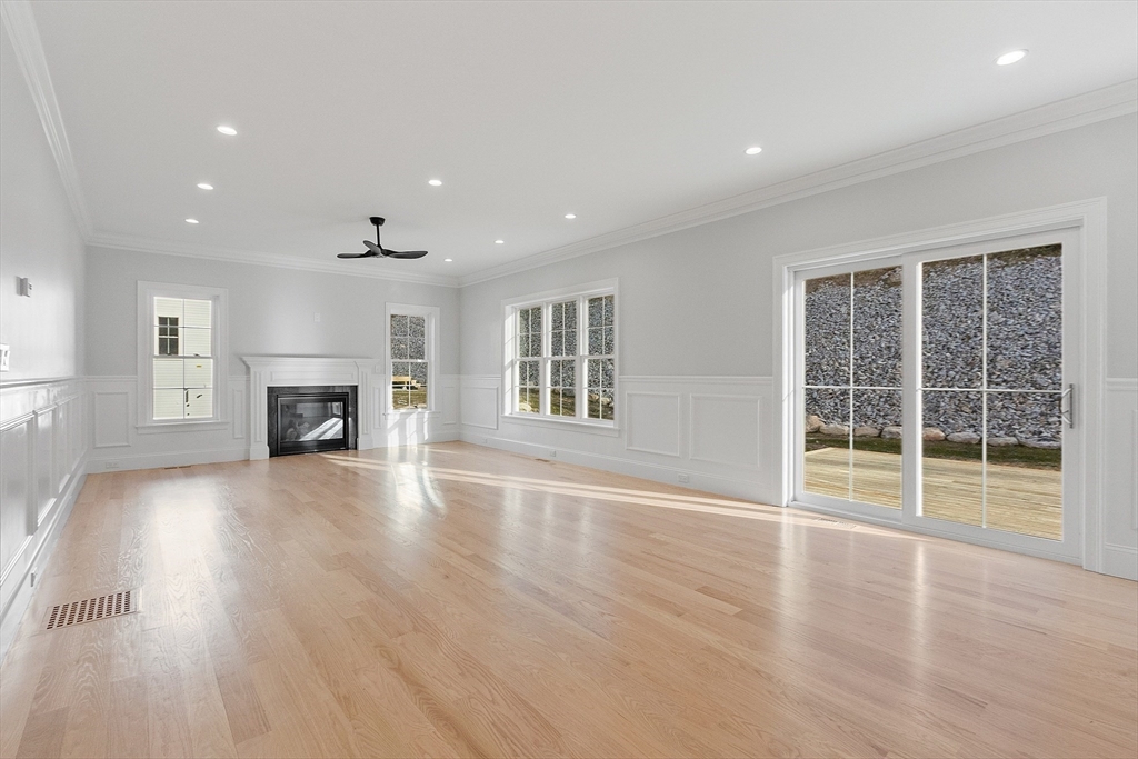 171 Upper Gore Road Webster, MA 01570 - Photo 19 of 42 a view of empty room with wooden floor and fireplace