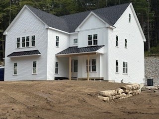 171 Upper Gore Road Webster, MA 01570 - Photo 2 of 11 a view of a white house with large windows