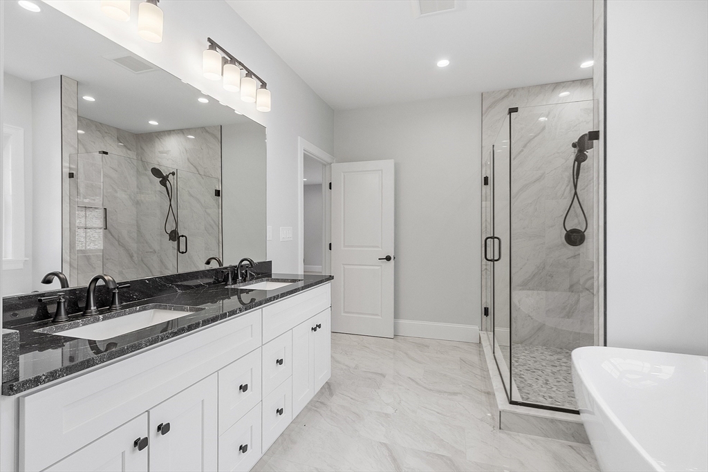 171 Upper Gore Road Webster, MA 01570 - Photo 30 of 42 a spacious bathroom with a granite countertop sink mirror and shower