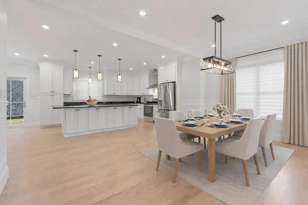 a view of empty room with window and wooden floor