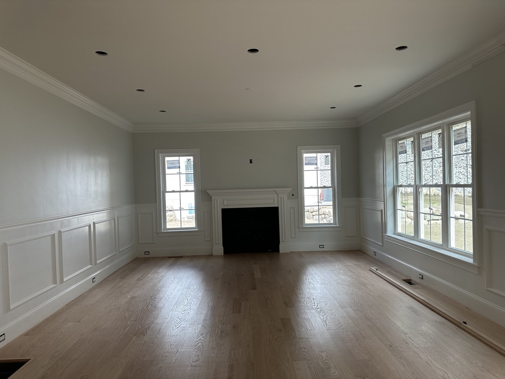 171 Upper Gore Road Webster, MA 01570 - Photo 6 of 11 a view of an empty room with a window and wooden floor