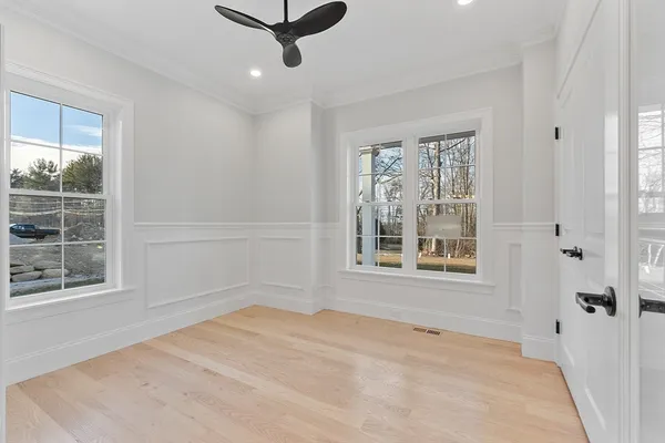 a large kitchen with granite countertop a large counter top stainless steel appliances and cabinets