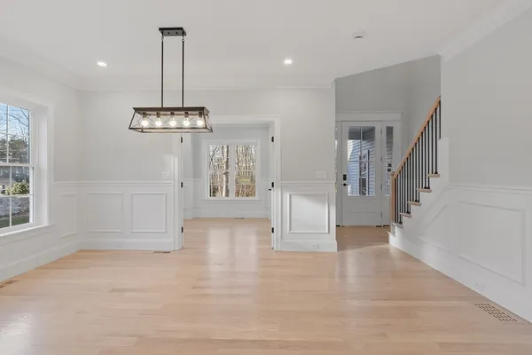 a kitchen with granite countertop a sink a stove and cabinets