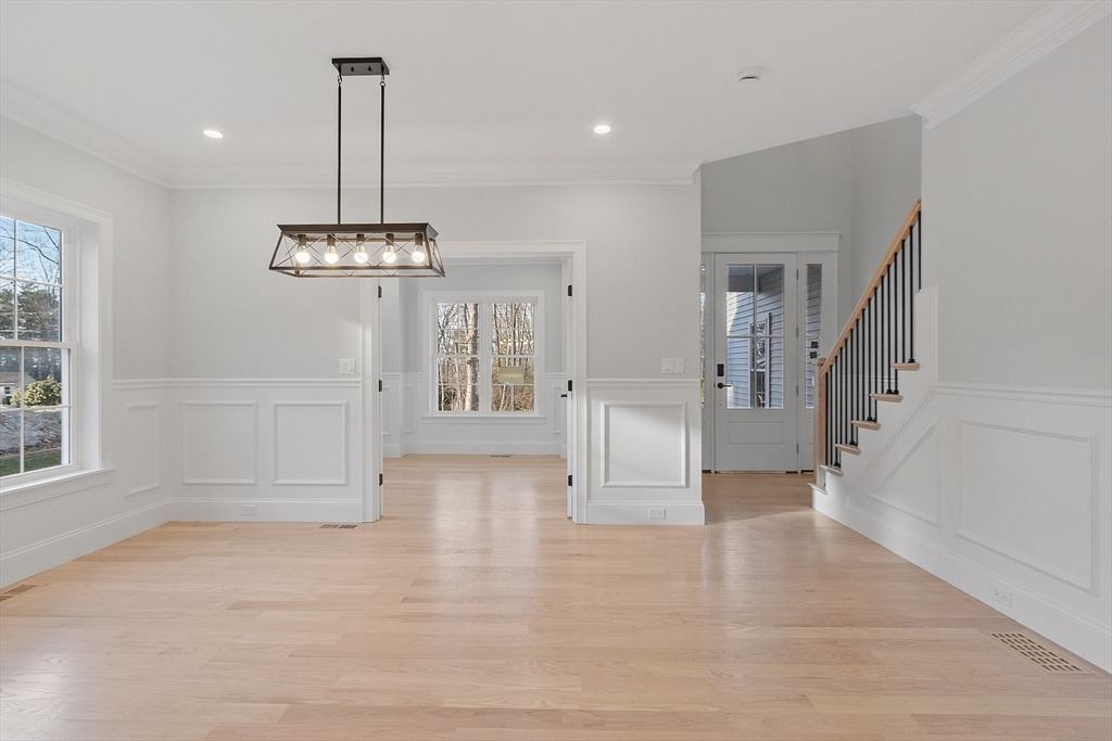 171 Upper Gore Road Webster, MA 01570 - Photo 10 of 42 a view of empty room with wooden floor and entryway