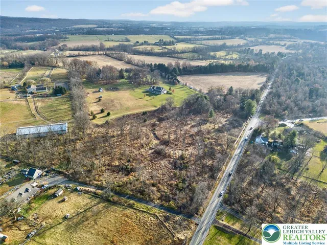 a view of a city with mountains in the background
