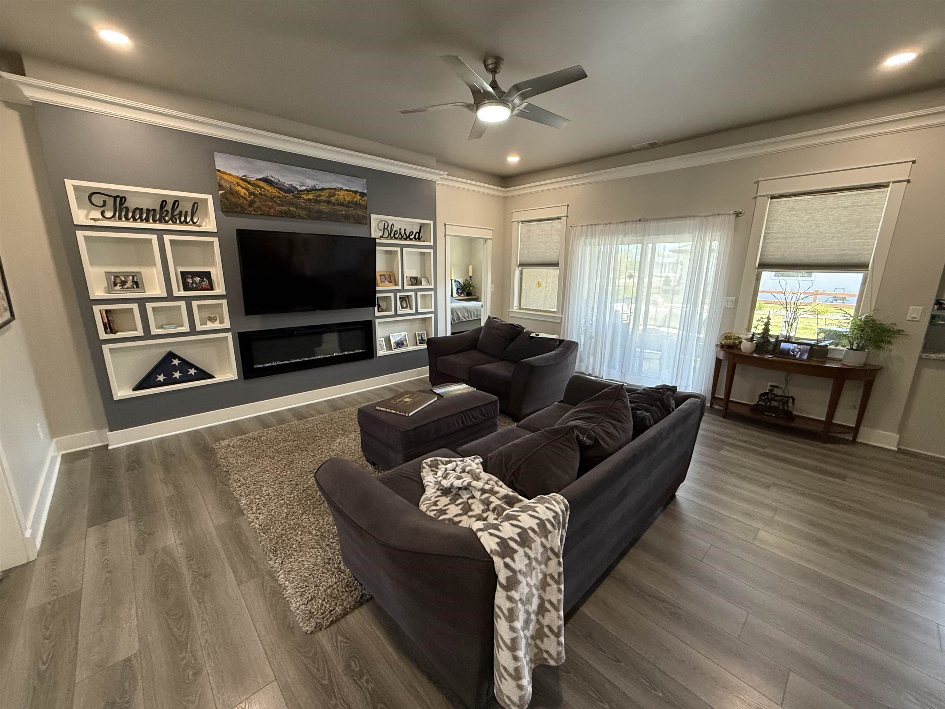 1210 Fairway Drive Fruita, CO 81521 - Photo 13 of 33 a living room with furniture and a flat screen tv