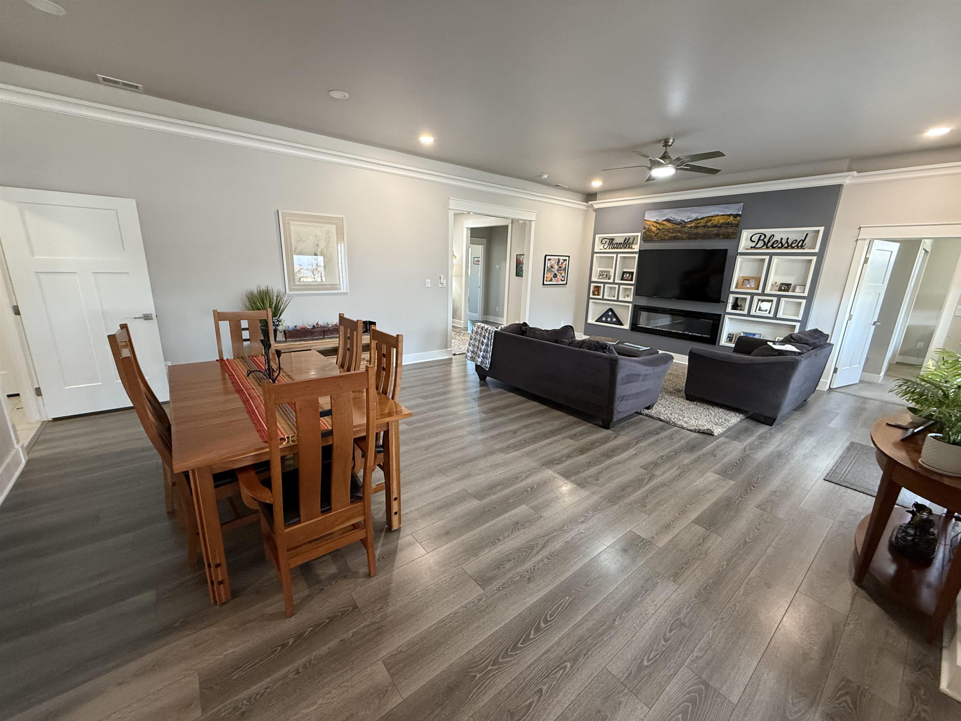 1210 Fairway Drive Fruita, CO 81521 - Photo 15 of 33 a view of a dining room with furniture window and wooden floor