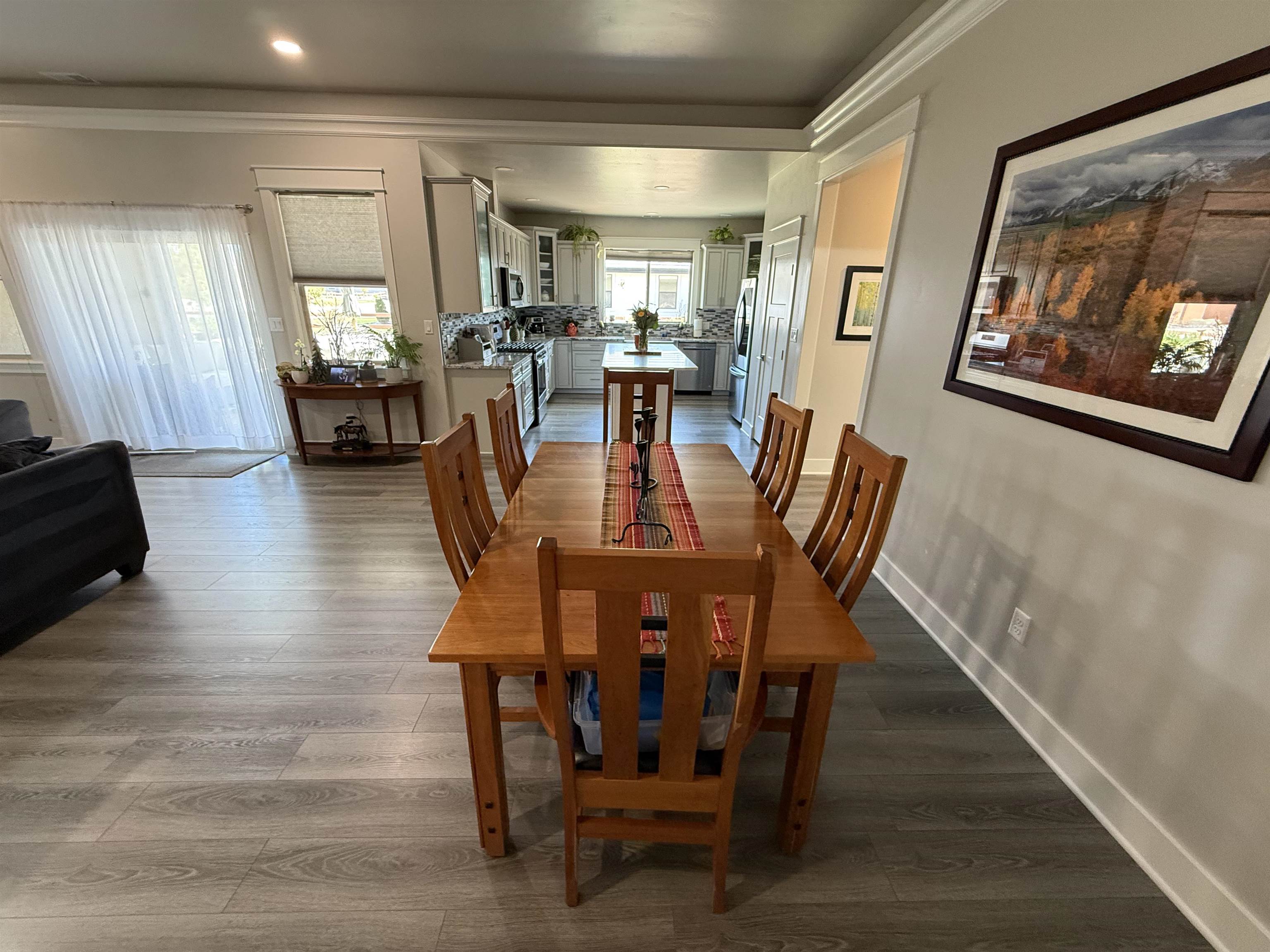 1210 Fairway Drive Fruita, CO 81521 - Photo 16 of 33 a view of a dining room with furniture window and wooden floor