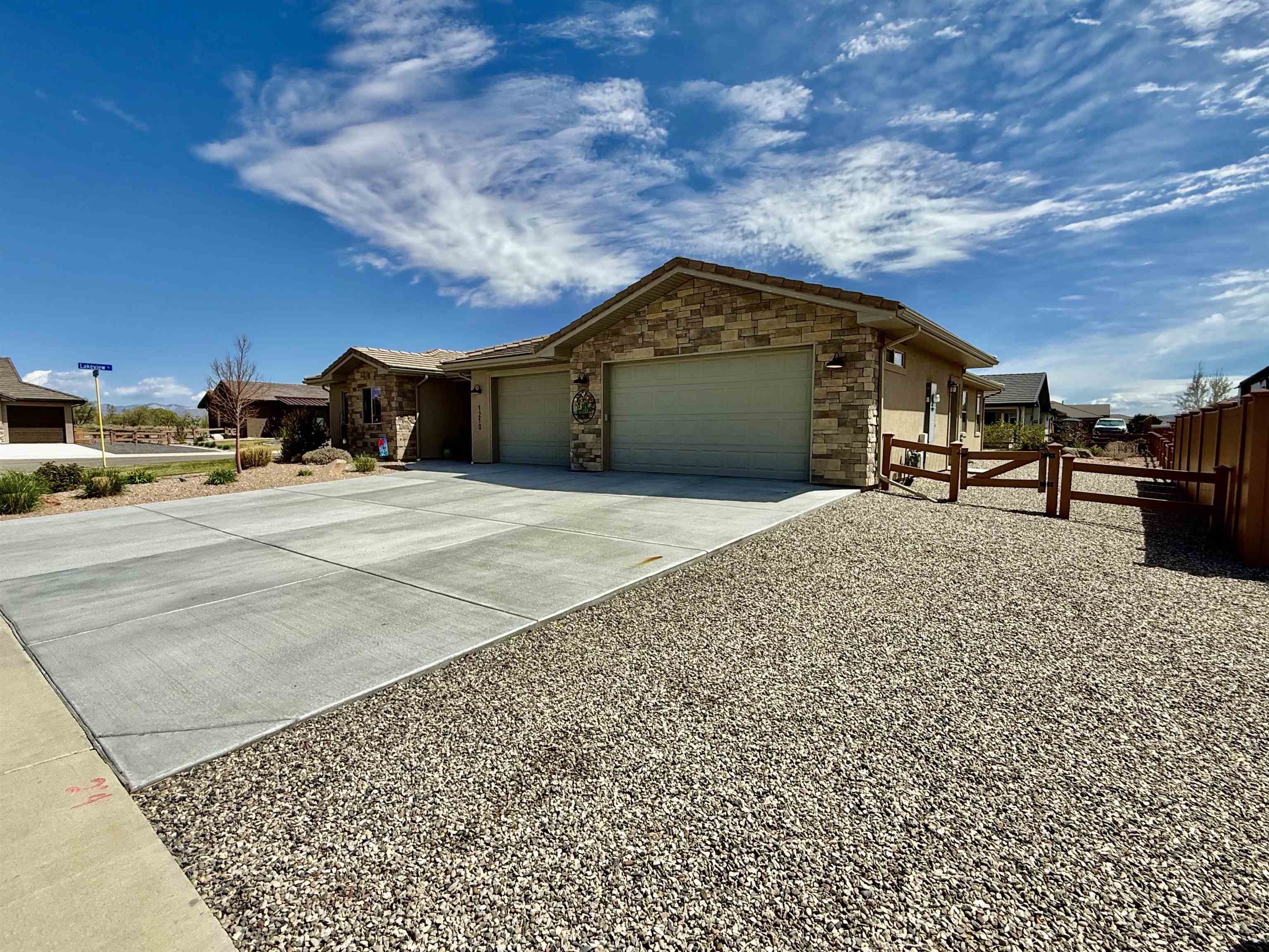 1210 Fairway Drive Fruita, CO 81521 - Photo 2 of 33 a front view of a house with a yard