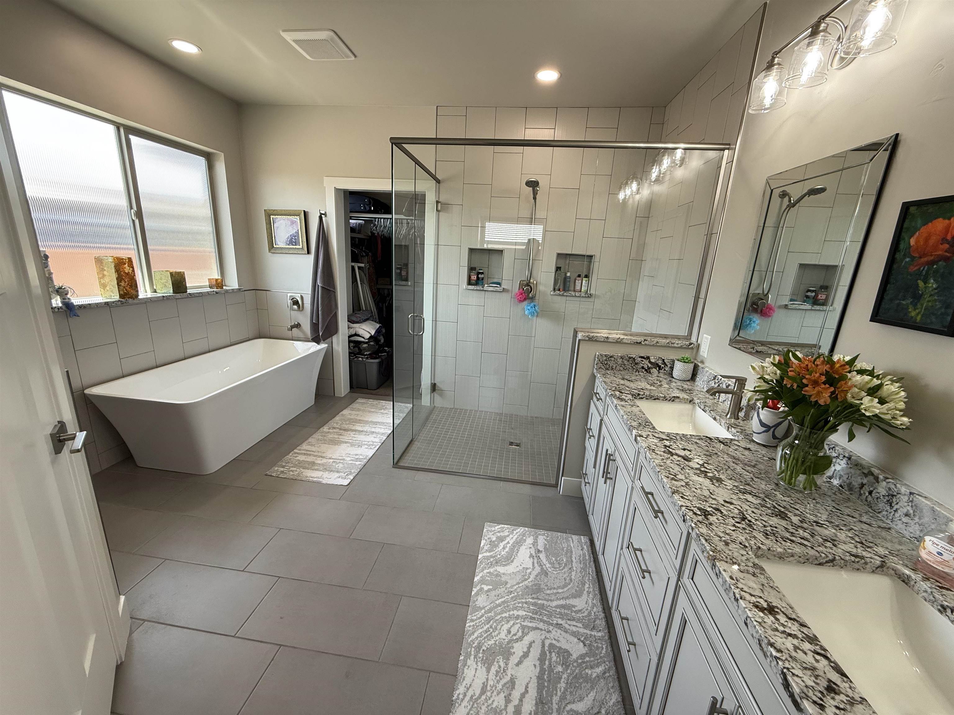 1210 Fairway Drive Fruita, CO 81521 - Photo 22 of 33 a bathroom with a tub sink a mirror and shower