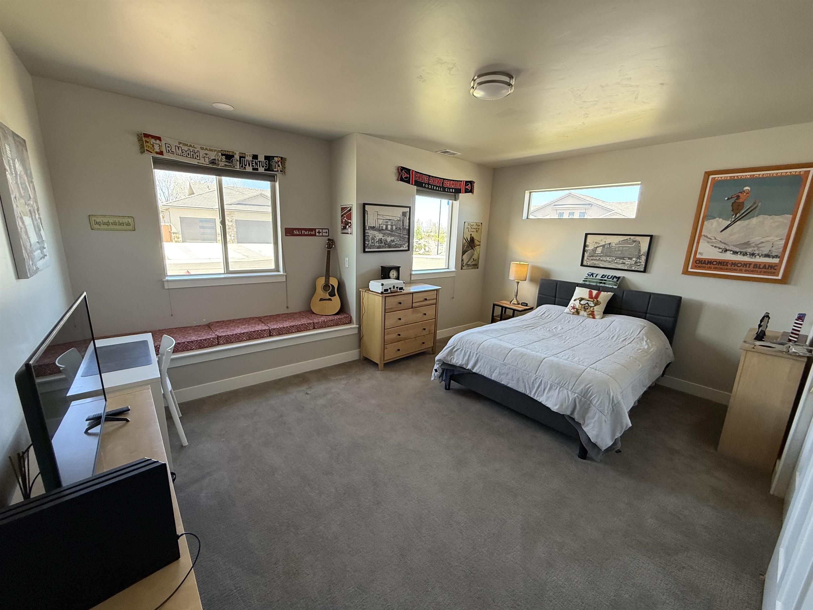 1210 Fairway Drive Fruita, CO 81521 - Photo 29 of 33 a bedroom with a bed and wooden floor