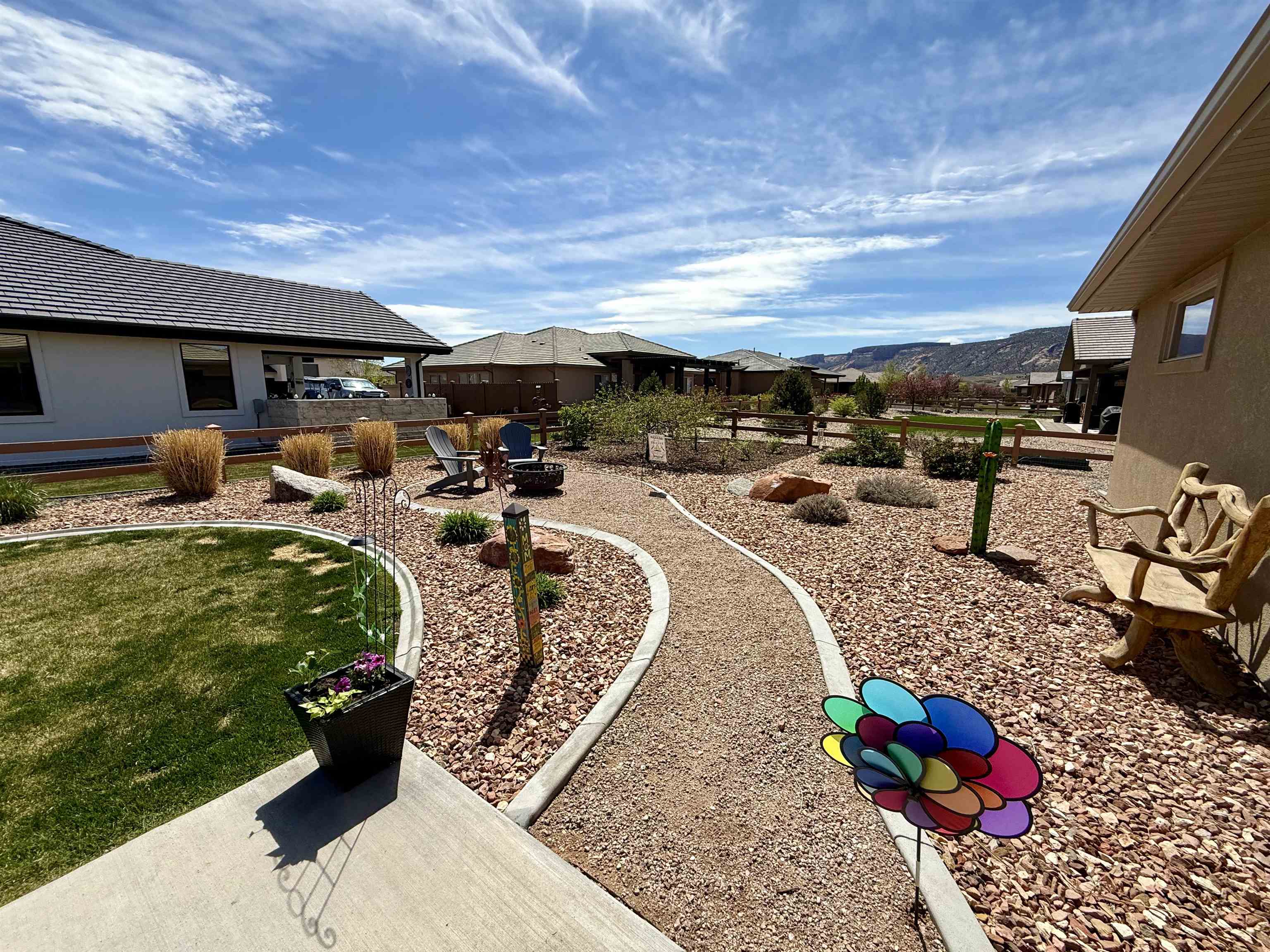1210 Fairway Drive Fruita, CO 81521 - Photo 7 of 33 a view of a backyard with table and chairs potted plants