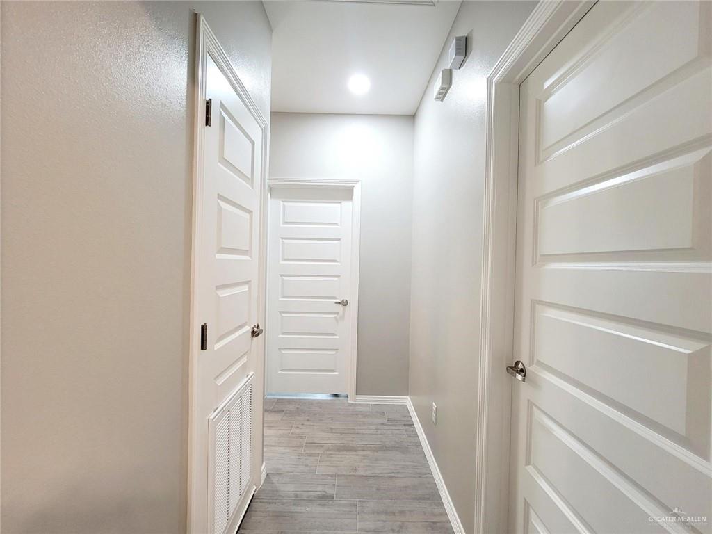 2109 Stauffer Street, Unit 4 Weslaco, TX 78596 - Photo 7 of 14 a view of a hallway with wooden floor and entryway