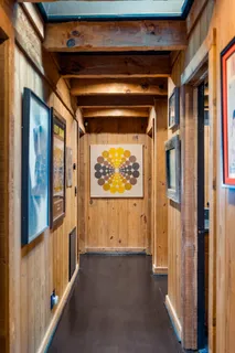 a blue bed sitting in a room next to a window