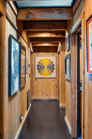 a blue bed sitting in a room next to a window