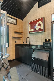 a backyard of a house with table and chairs