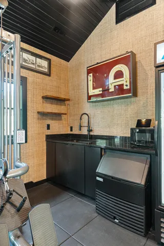 a backyard of a house with table and chairs