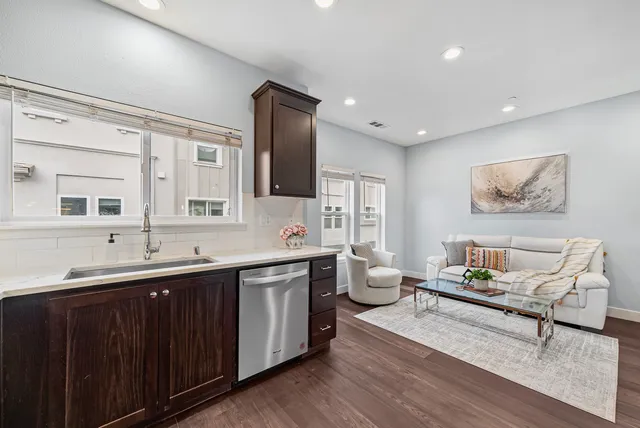 a spacious bathroom with a double vanity sink a mirror and a bathtub
