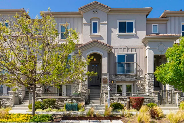 a front view of a house with swimming pool