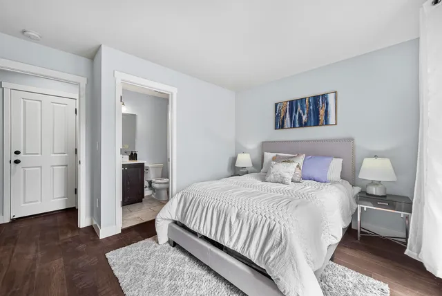 a bedroom with a bed and a view of bathroom