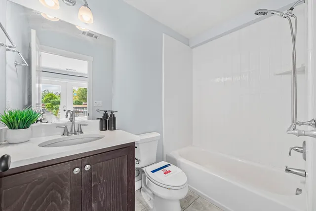 a bathroom with a sink a toilet and a bathtub