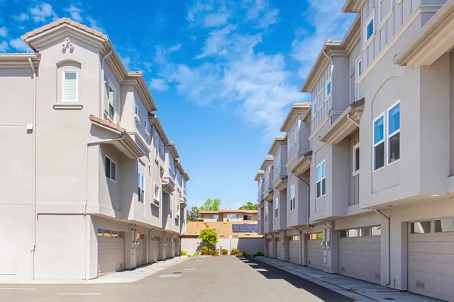 a view of a brick building with many windows