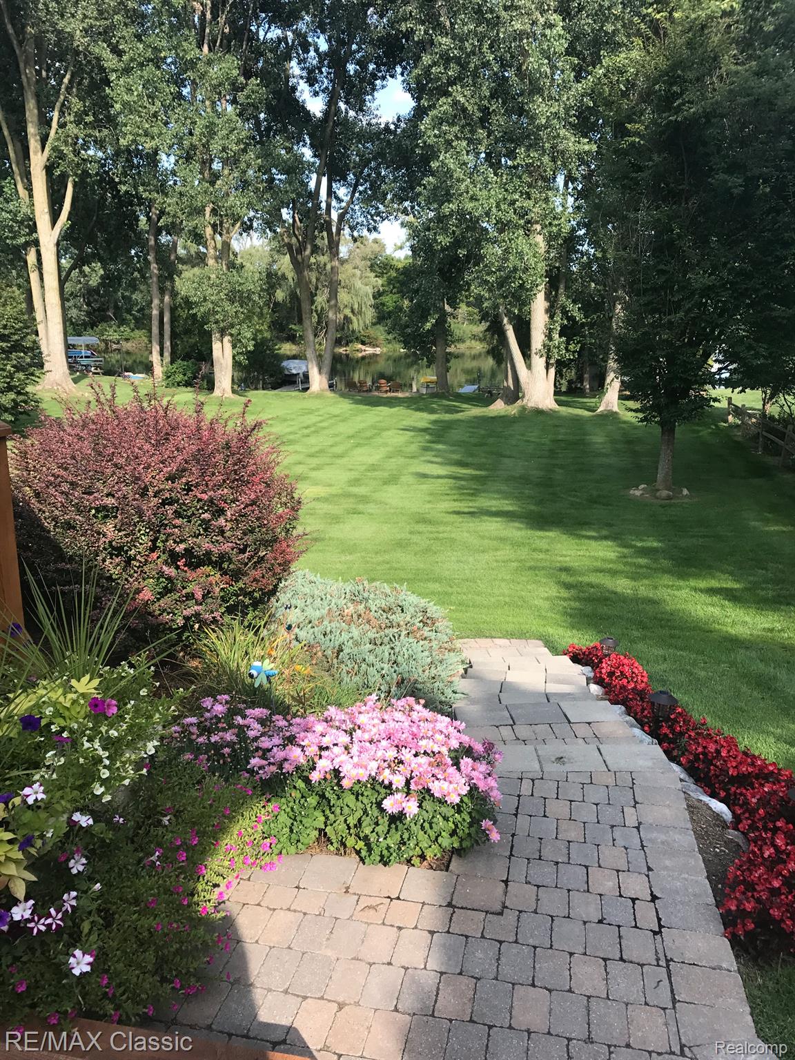 5280 Inverrary Lane Commerce Township, MI 48382 - Photo 5 of 16 Stunning landscape and perennial flowers