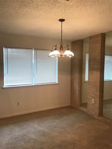 a view of a room that has a chandelier