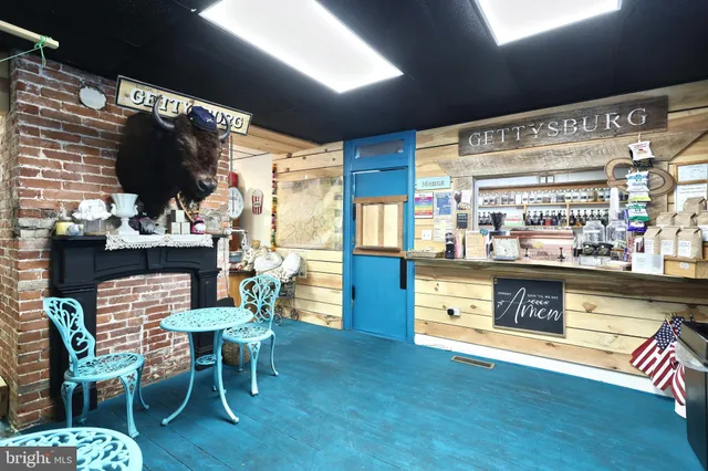 a bathroom with a sink toilet and mirror