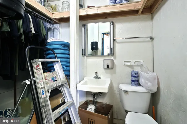a kitchen with a refrigerator and a stove
