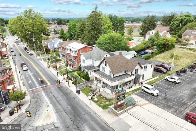 an aerial view of a house with a lake view