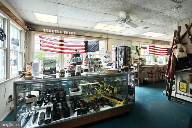 a living room with lots of furniture and wooden floor